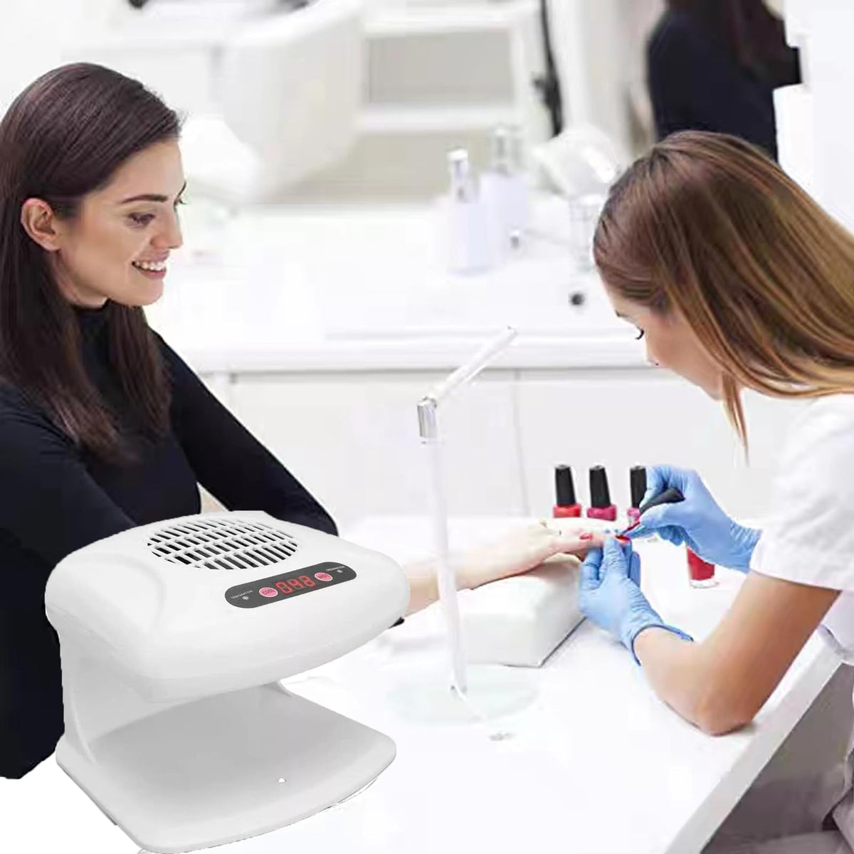 GGAIFbp next to a hand for scale demonstrating compact salon-friendly size