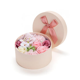 Giga Gud open gift box with assorted rose and carnation soaps arranged neatly