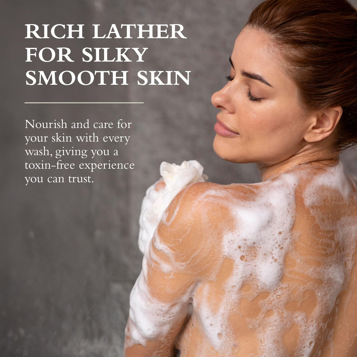 Gilchrist & Soames bottle beside towel suggesting post-shower softness and hydrated skin