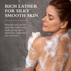 Gilchrist & Soames bottle beside towel suggesting post-shower softness and hydrated skin