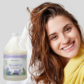 Ginger Lily Farms gallon near shower dispensers in bathroom showing eco refill use