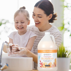 Ginger Lily Farms gallon beside bathroom dispenser for bulk convenience