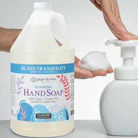 Ginger Lily Farms gallon bottle staged in a spa setting conveying a calm scent and professional use
