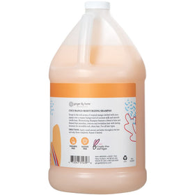 Ginger Lily Farms pouring shampoo into a dispenser for economical refill use