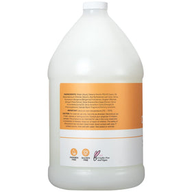 Pouring conditioner texture from Ginger Lily Farms bottle illustrating smooth, hydrating formula