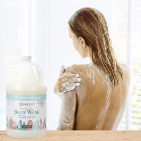 Ginger Lily Farms bottle in a spa-style bathroom conveying calming, fresh scent benefit