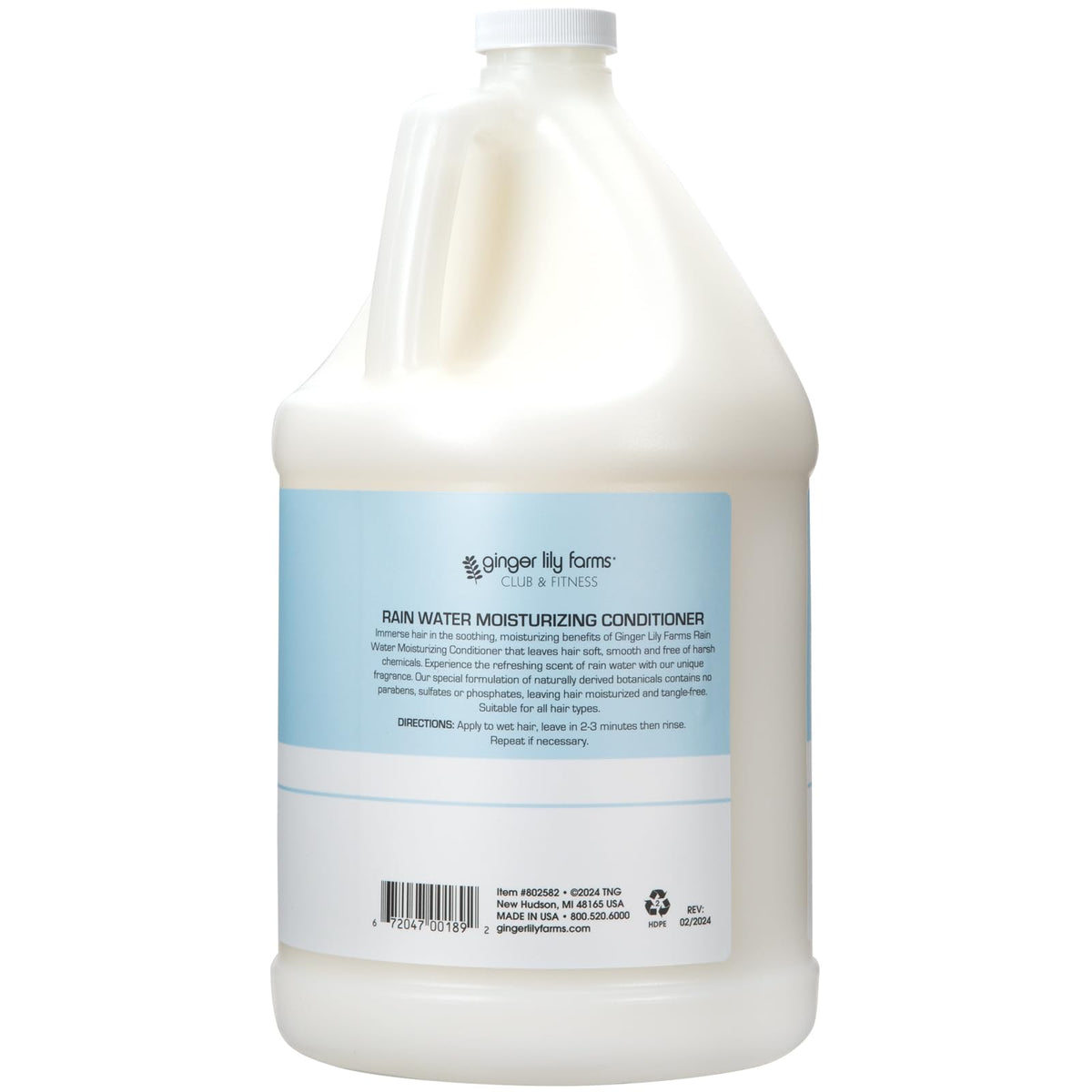 Ginger Lily Farms pouring conditioner into dispenser for eco-friendly refill
