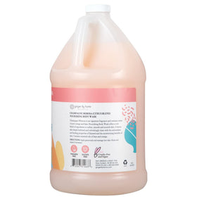 Ginger Lily Farms body wash texture pouring from bottle, demonstrating rich creamy lather