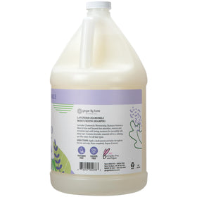 Ginger Lily Farms shampoo being poured to show creamy texture and moisture boost