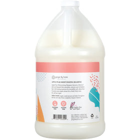 Ginger Lily Farms shampoo being dispensed from a pump for convenient refilling
