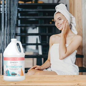 Ginger Lily Farms lotion pour next to measuring cup showing one-gallon capacity