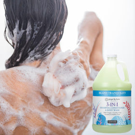Ginger Lily Farms gallon next to salon bottle showing economical size benefit