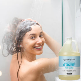 Ginger Lily Farms shampoo in shower setting offering refreshing rain scent