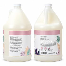 Ginger Lily Farms pouring refill into dispenser for economical reuse