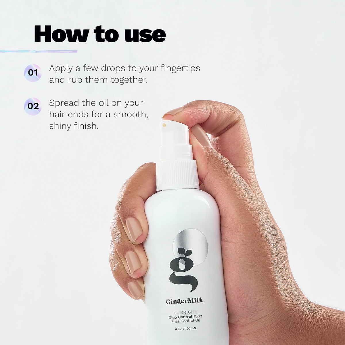 Stylist applying Ginger Milk oil to damp hair for frizz control benefit