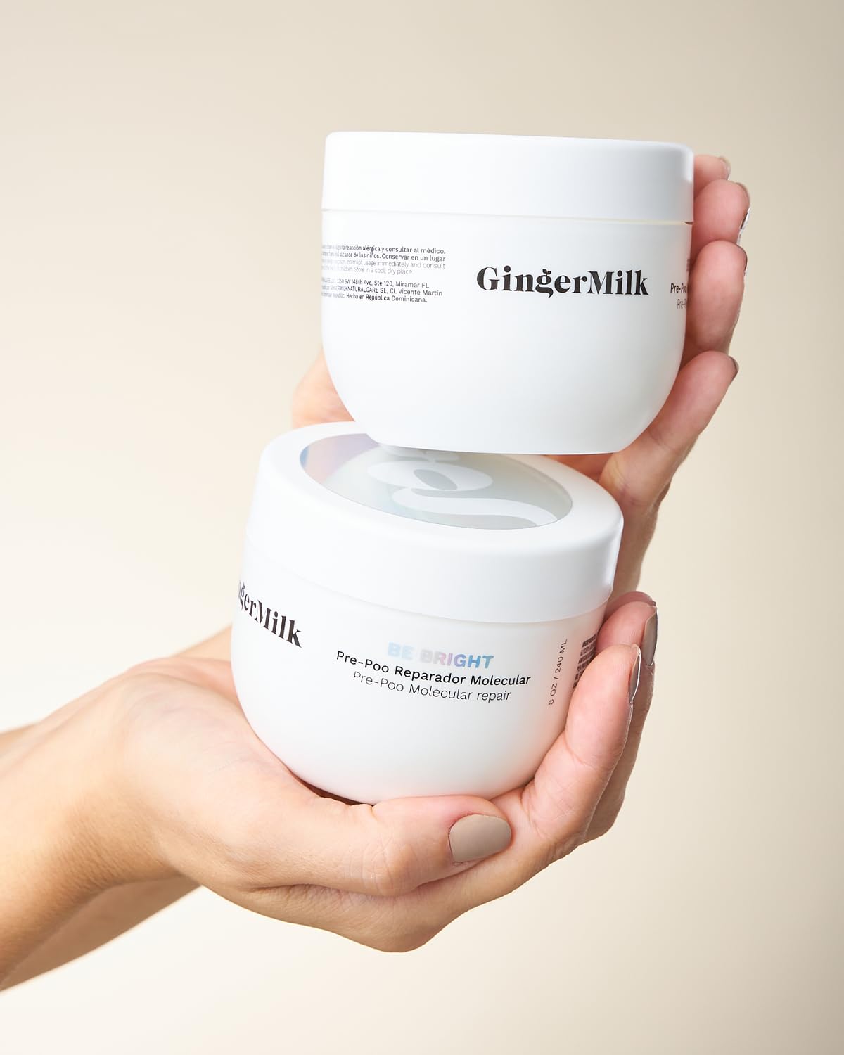 Ginger Milk Natural Care hands scooping mask to show concentrated texture