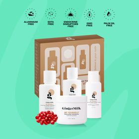 Ginger Milk bottles in hand for scale showing TSA-friendly travel sizes