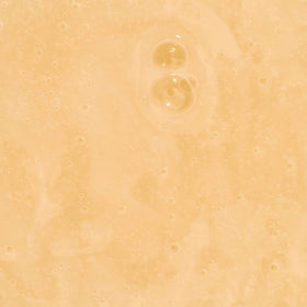 Ginger Milk used outdoors showing sun protection and frizz control benefit