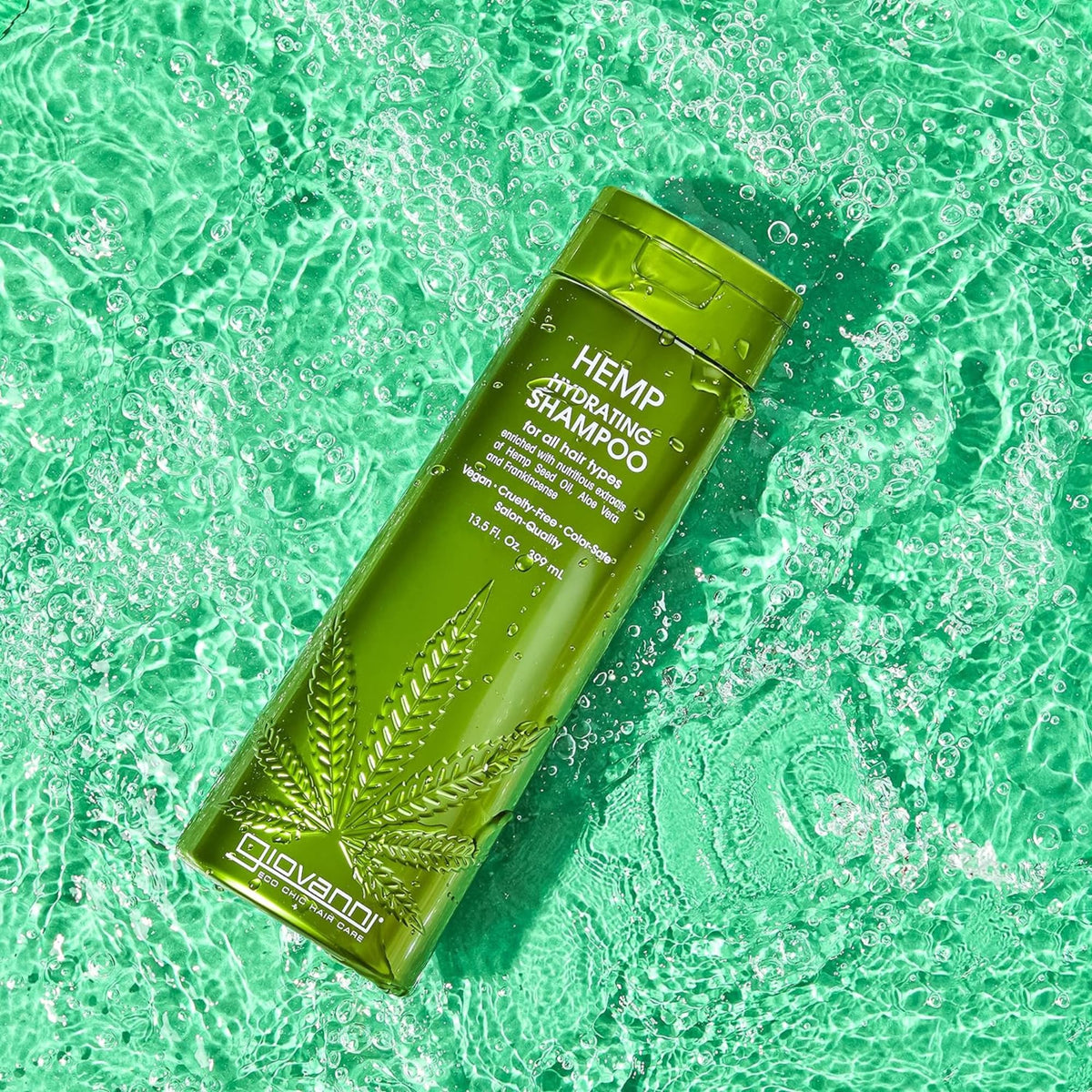 GIOVANNI shampoo with aloe vera and hemp seeds nearby, highlights natural ingredients