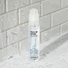 GIOVANNI serum on hands ready to apply for smooth, frizz-free hair