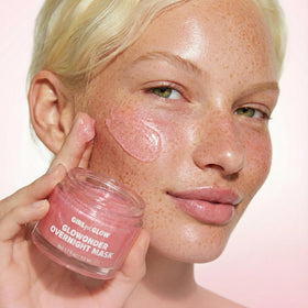 Girl Got Glow jar held between hands to show 50 mL size and travel-friendly benefit
