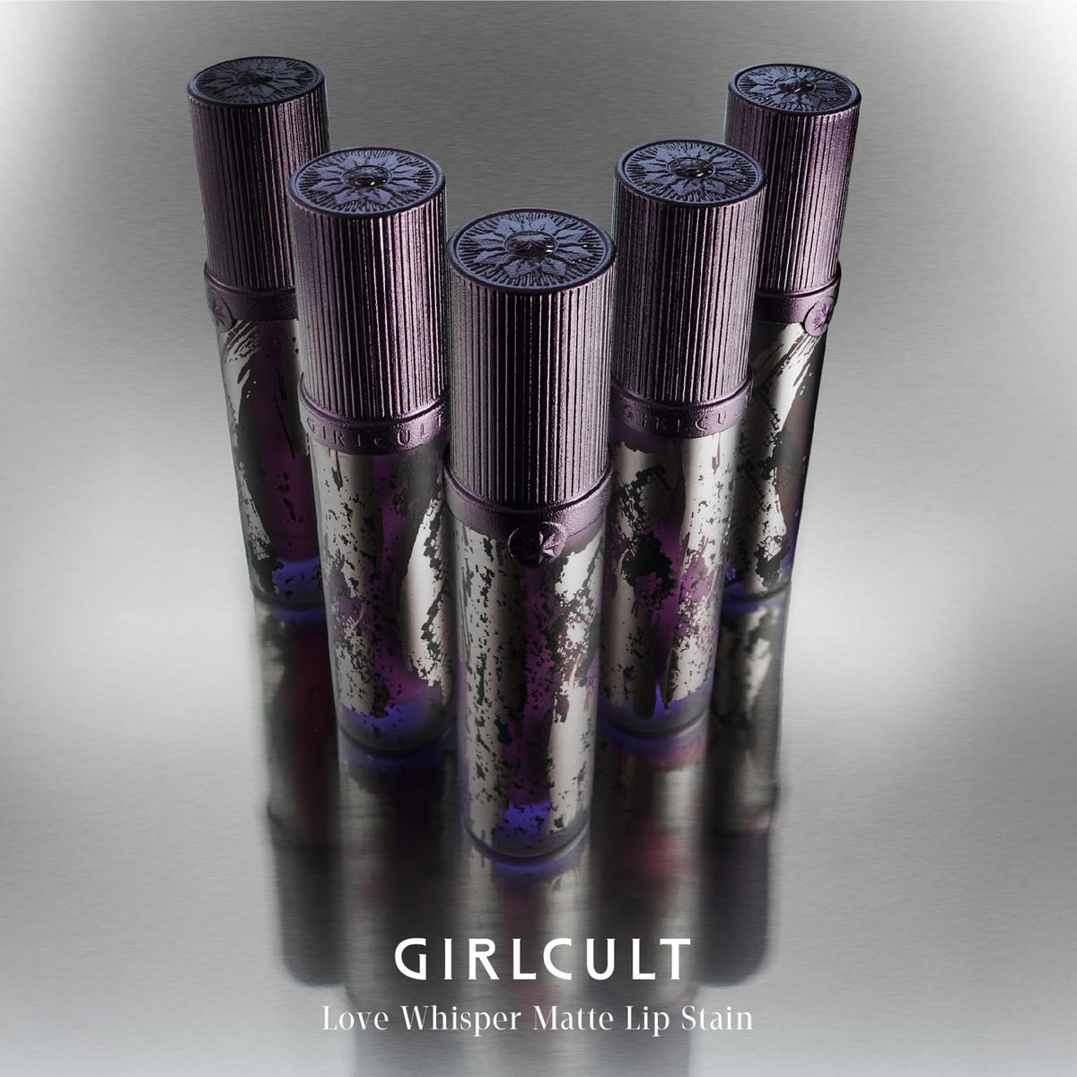 GIRLCULT tube in hand for scale, illustrating travel-friendly size