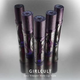 GIRLCULT tube in hand for scale, illustrating travel-friendly size