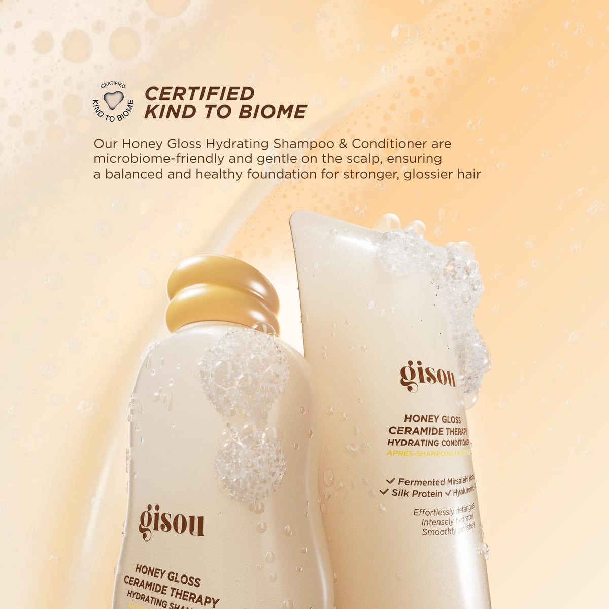 Gisou conditioner being applied to long wet hair in shower for improved manageability and frizz control