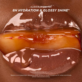 Gisou Glazed Plum lip swipe on arm showing rich tint and reflective shine