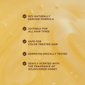 Gisou close-up label highlighting honey, ceramides and AHAs benefits