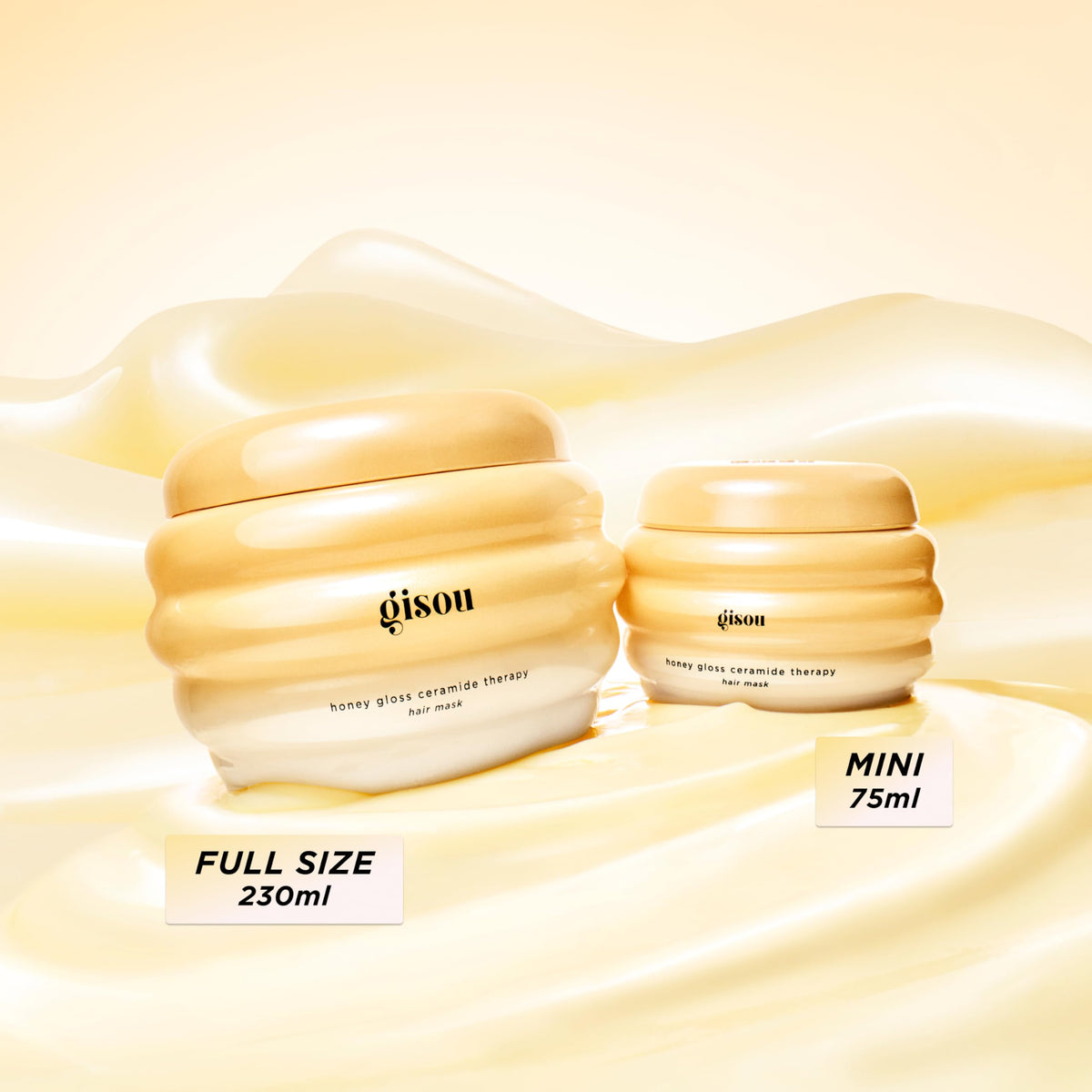 Hand holding Gisou 7.8 fl oz jar to show scale and travel-friendly size