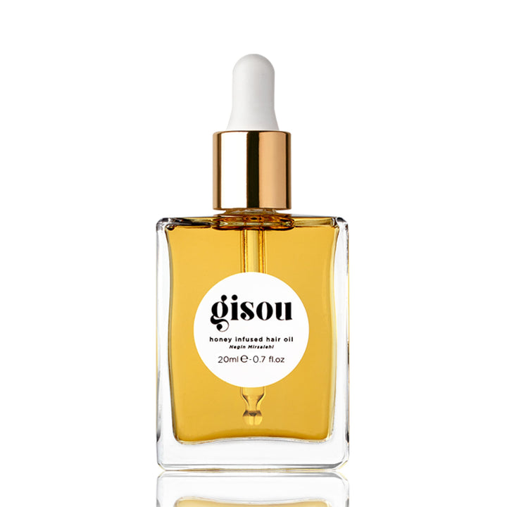 Gisou front packaging showing compact travel-friendly oil and glossy benefit