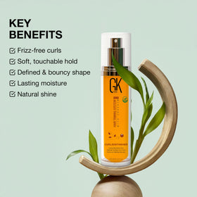 GK HAIR applying cream to damp hair demonstrating easy distribution