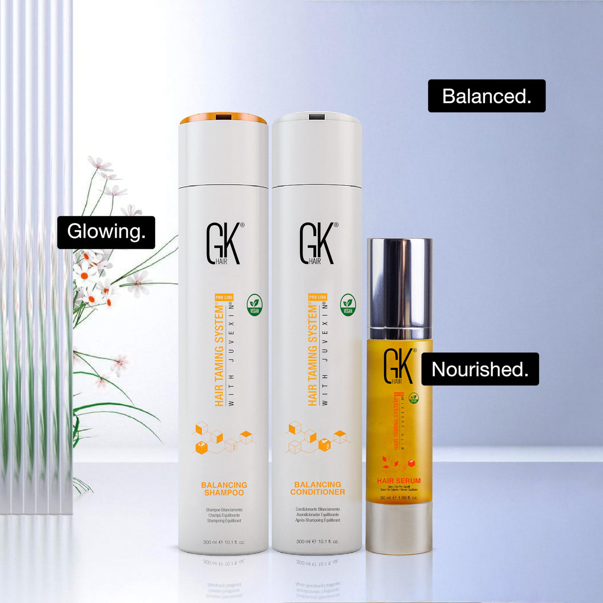 GK HAIR bottles beside a ruler showing actual 300ml and 50ml sizes