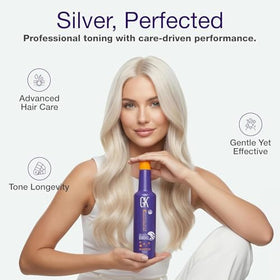 GK HAIR bottle in hand for scale showing compact travel-size benefit