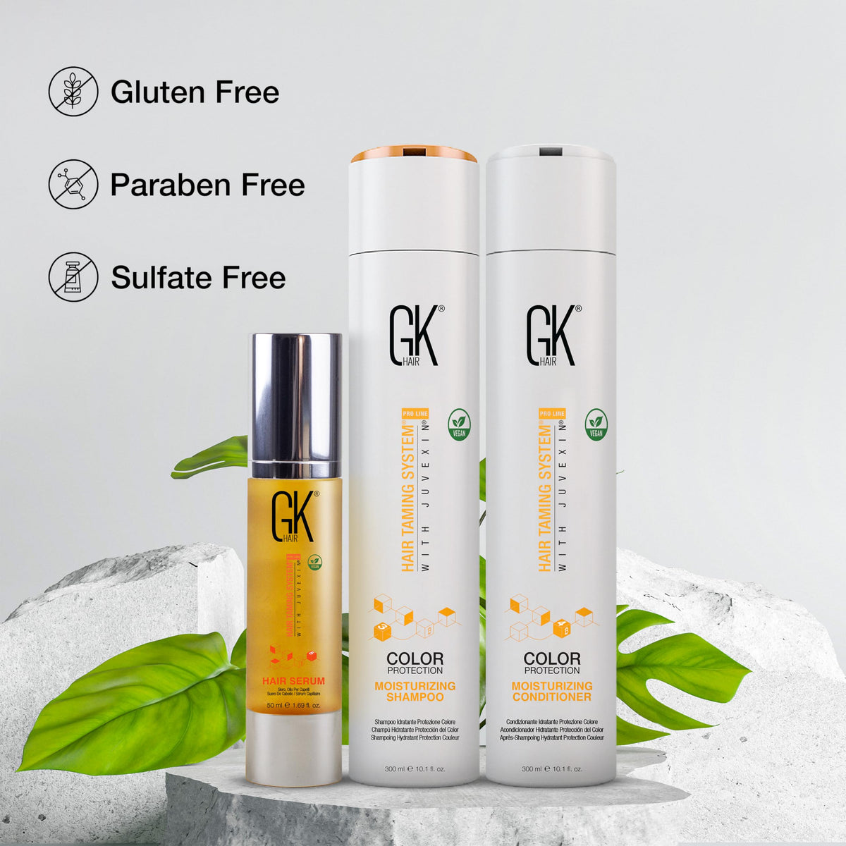 GK HAIR bottles in hand scale comparison emphasizing travel-friendly 10.1 oz sizes