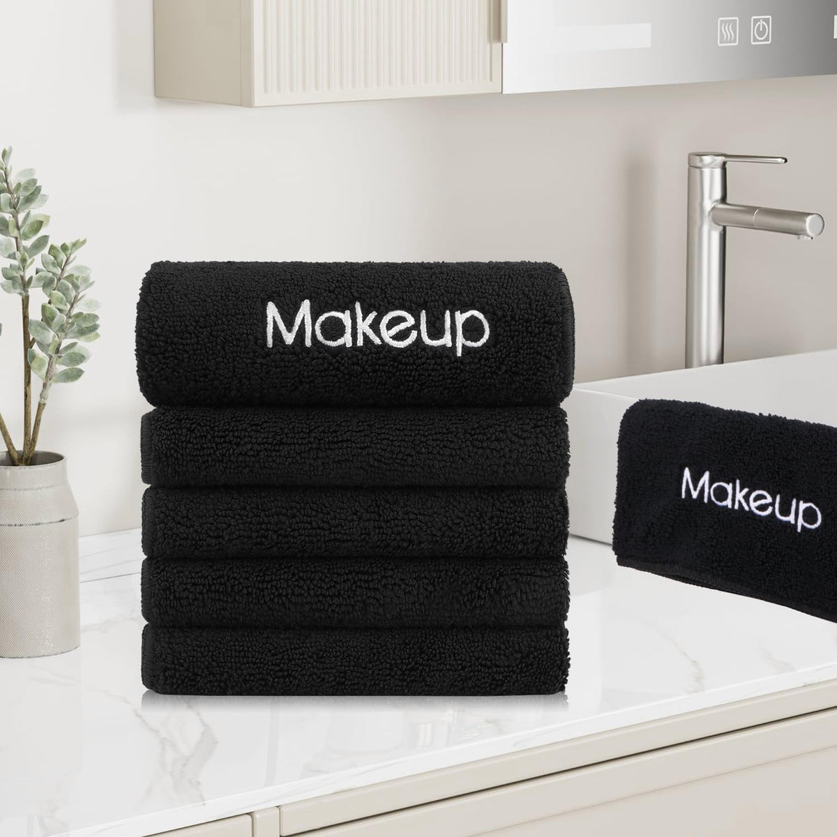 GLIMGLINT towels on bathroom vanity lifestyle suggesting reusable eco-friendly routine