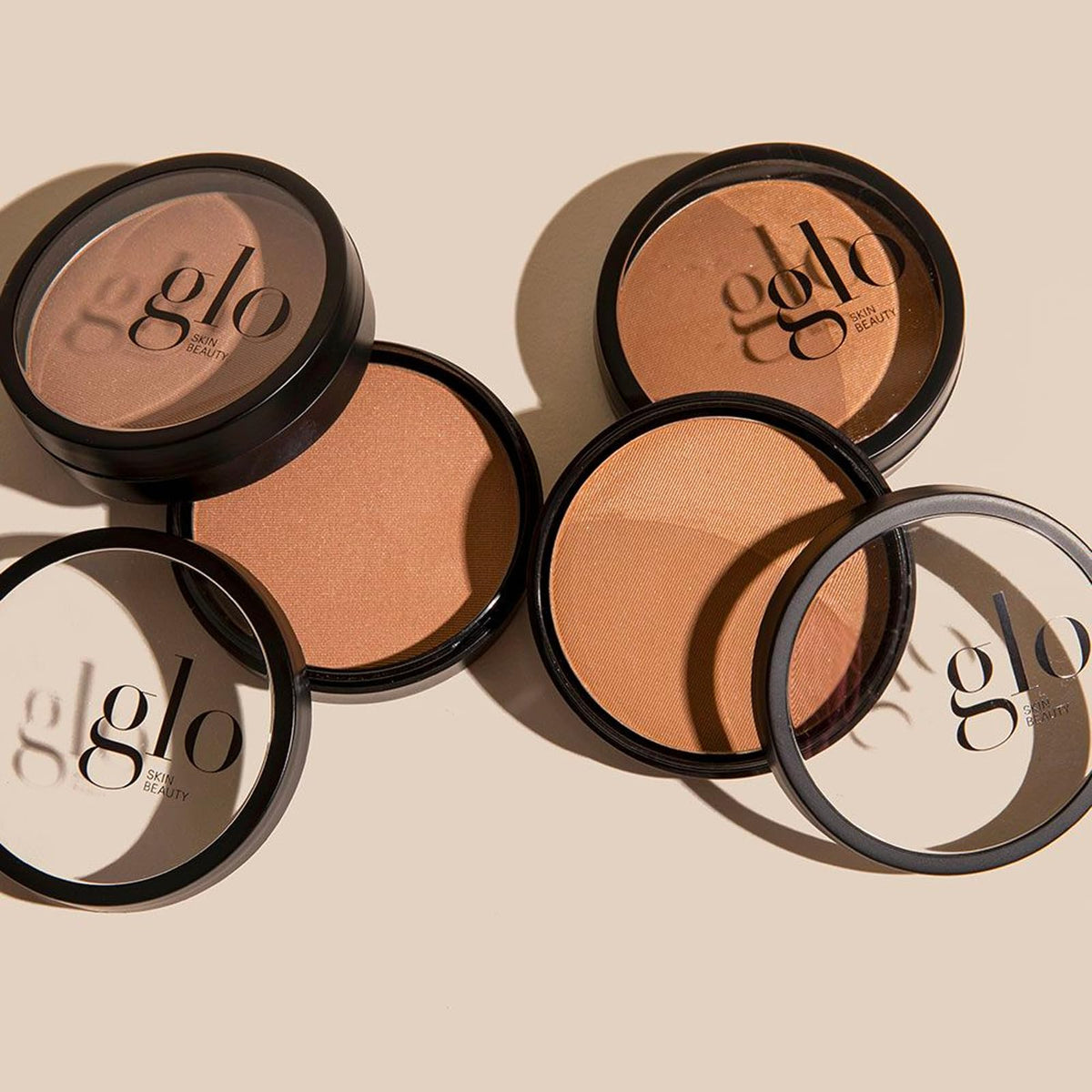 Model applying Glo Skin Beauty bronzer to cheekbone for natural contouring benefit