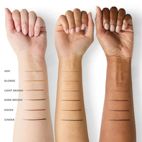Glo Skin Beauty browliner next to a hand for scale and easy portability
