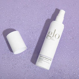 Glo Skin Beauty model using mist for instant refresh and dewy finish