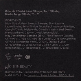 Glo Skin Beauty compact next to coin for size and portability