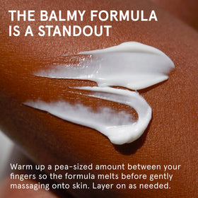 Glossier After Baume being scooped onto fingers showing easy application and barrier support