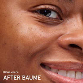 Glossier After Baume next to ruler showing 1.6 fl oz size and travel-friendly convenience