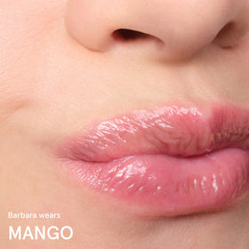 Glossier Balm Dotcom label close-up showing ingredients and nourishing benefits