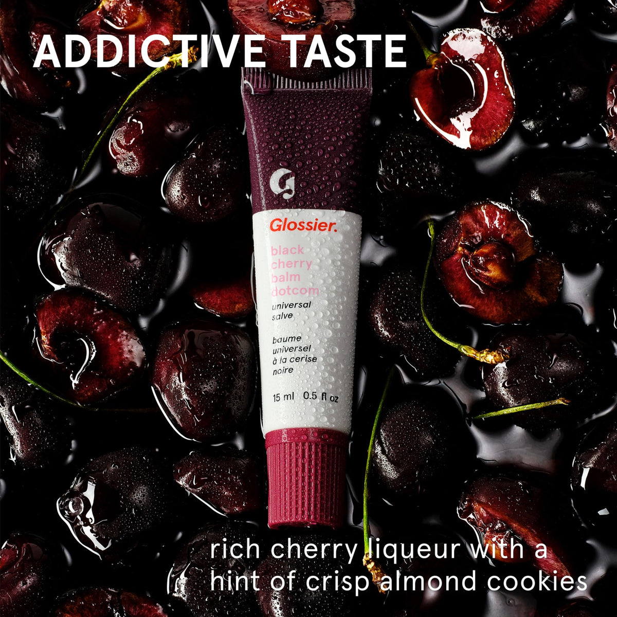 Glossier Balm Dotcom swatch on skin showing sheer burgundy color and moisturization