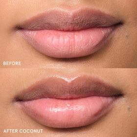 Glossier Balm Dotcom tube held in hand to show compact travel size