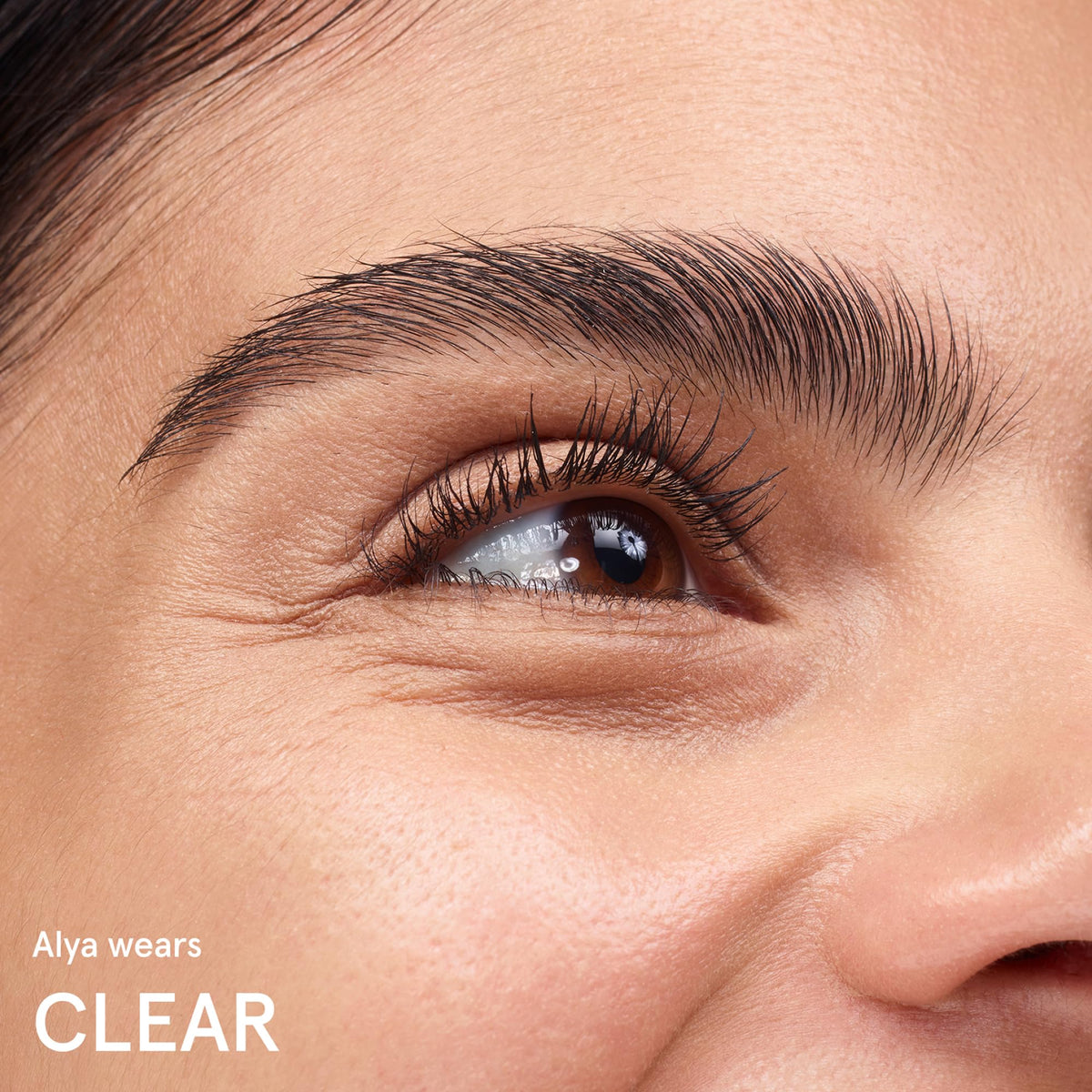 Glossier Boy Brow label close-up displays ingredient cues and product claims