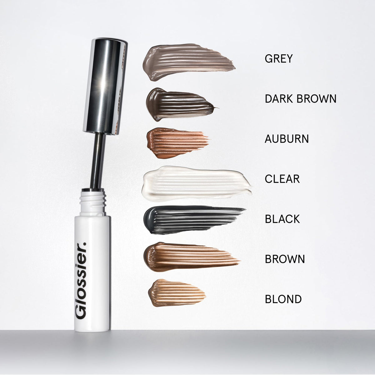 Glossier Boy Brow in hand demonstrates size and travel-friendly portability