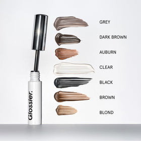 Glossier Boy Brow label close-up highlighting conditioning ingredients