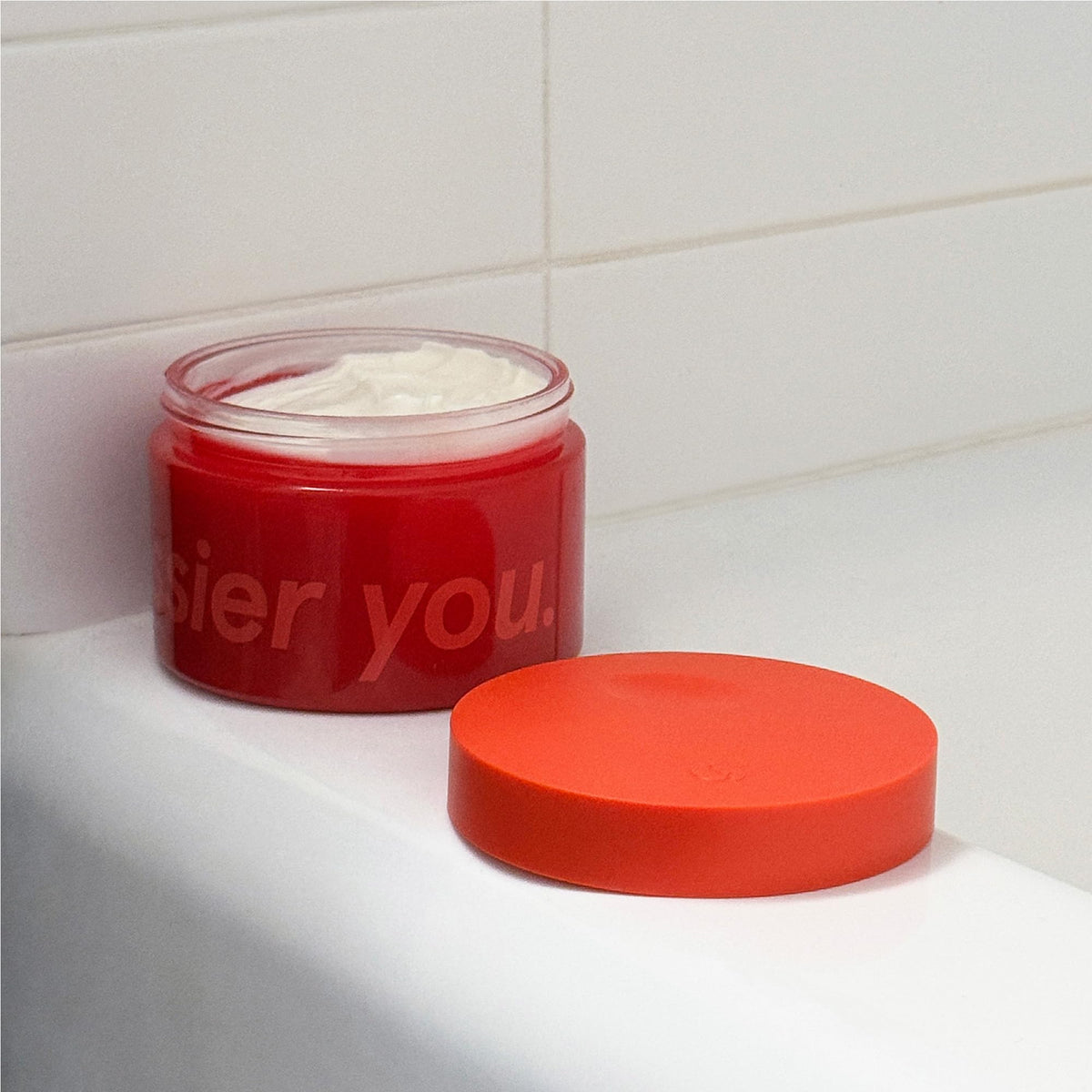 Glossier shea butter and jojoba oil ingredients displayed to show nourishment